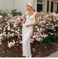 Holiday-style double-layer netted floral halter dress with lace stitching and tie straps, high-waisted and figure-hugging long dress