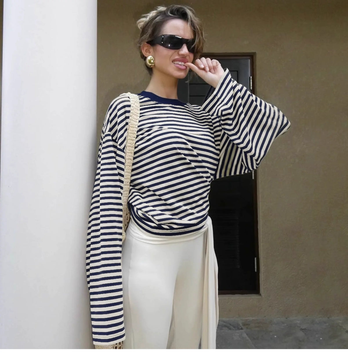 Fashionable loose and casual color-blocked striped printed round-neck long-sleeved top for women in early autumn, trendy and versatile T-shirt