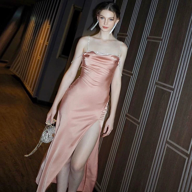Sexy one-shoulder backless tie-wrapped halter dress with high waistline, showing off the figure, side slit, knee-length long skirt