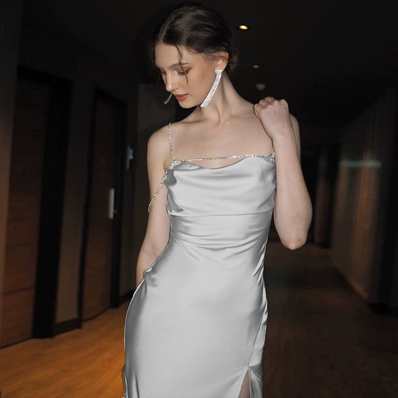 Sexy one-shoulder backless tie-wrapped halter dress with high waistline, showing off the figure, side slit, knee-length long skirt