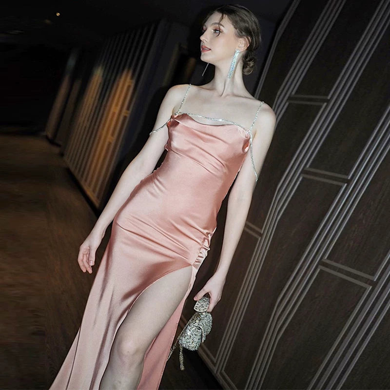 Sexy one-shoulder backless tie-wrapped halter dress with high waistline, showing off the figure, side slit, knee-length long skirt