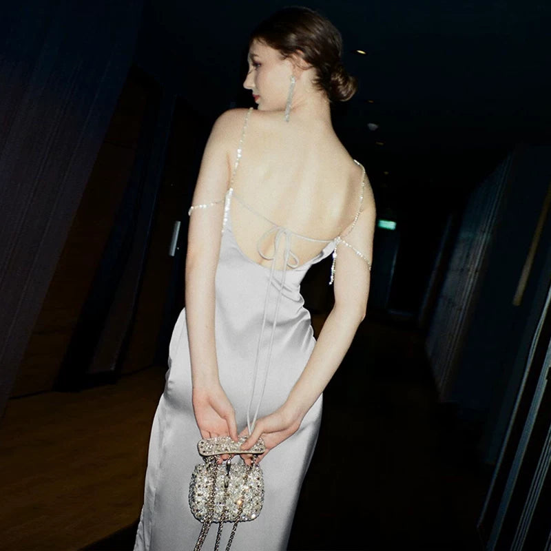 Sexy one-shoulder backless tie-wrapped halter dress with high waistline, showing off the figure, side slit, knee-length long skirt