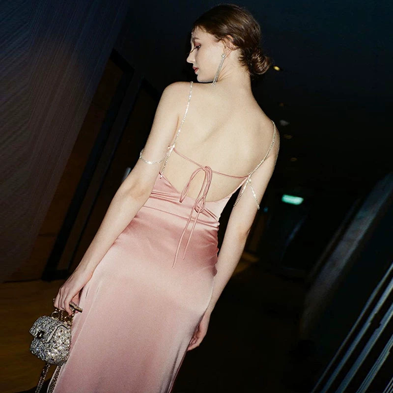 Sexy one-shoulder backless tie-wrapped halter dress with high waistline, showing off the figure, side slit, knee-length long skirt